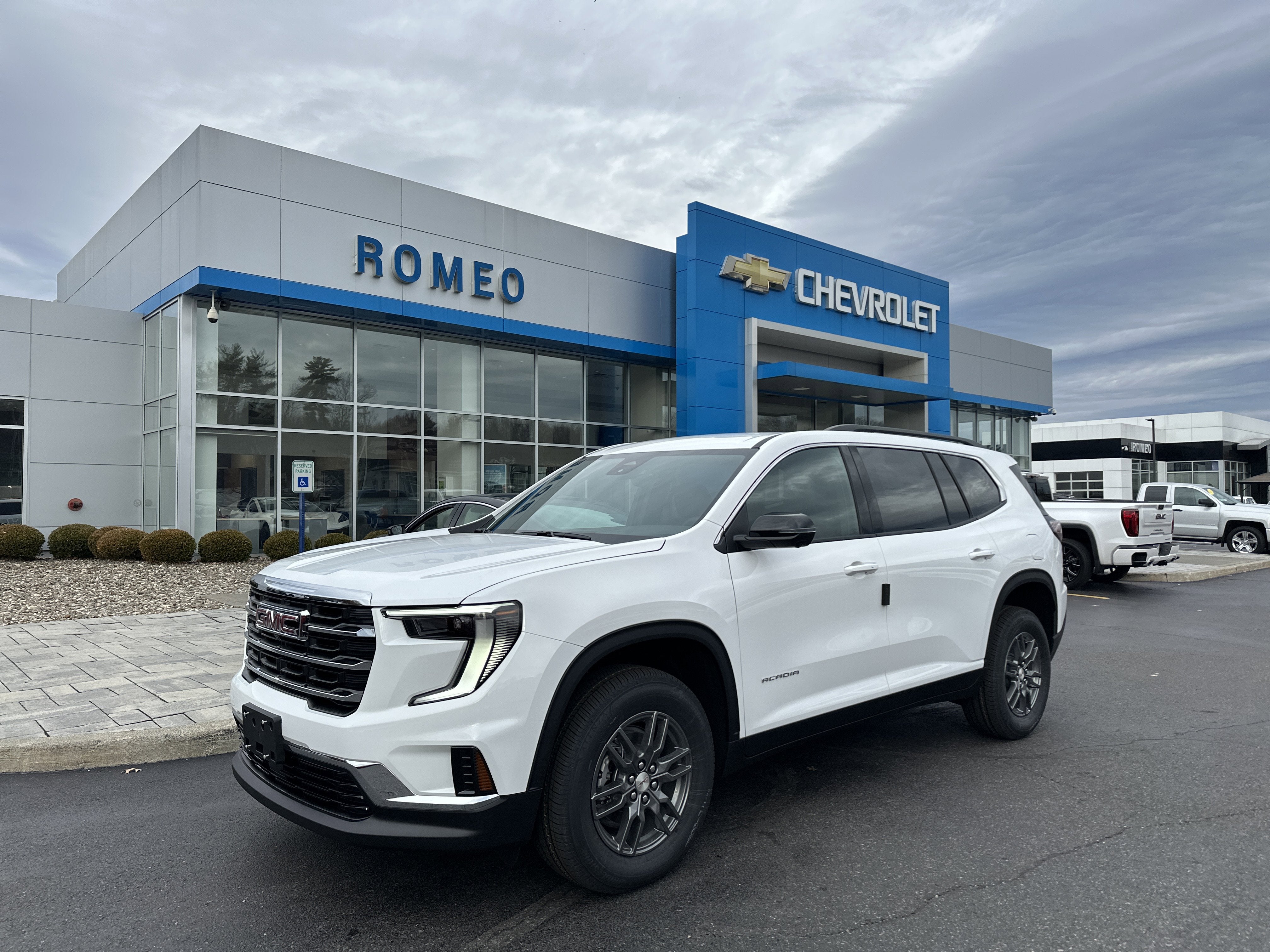 2026 GMC Acadia Elevation in Summit White — front three-quarter view
