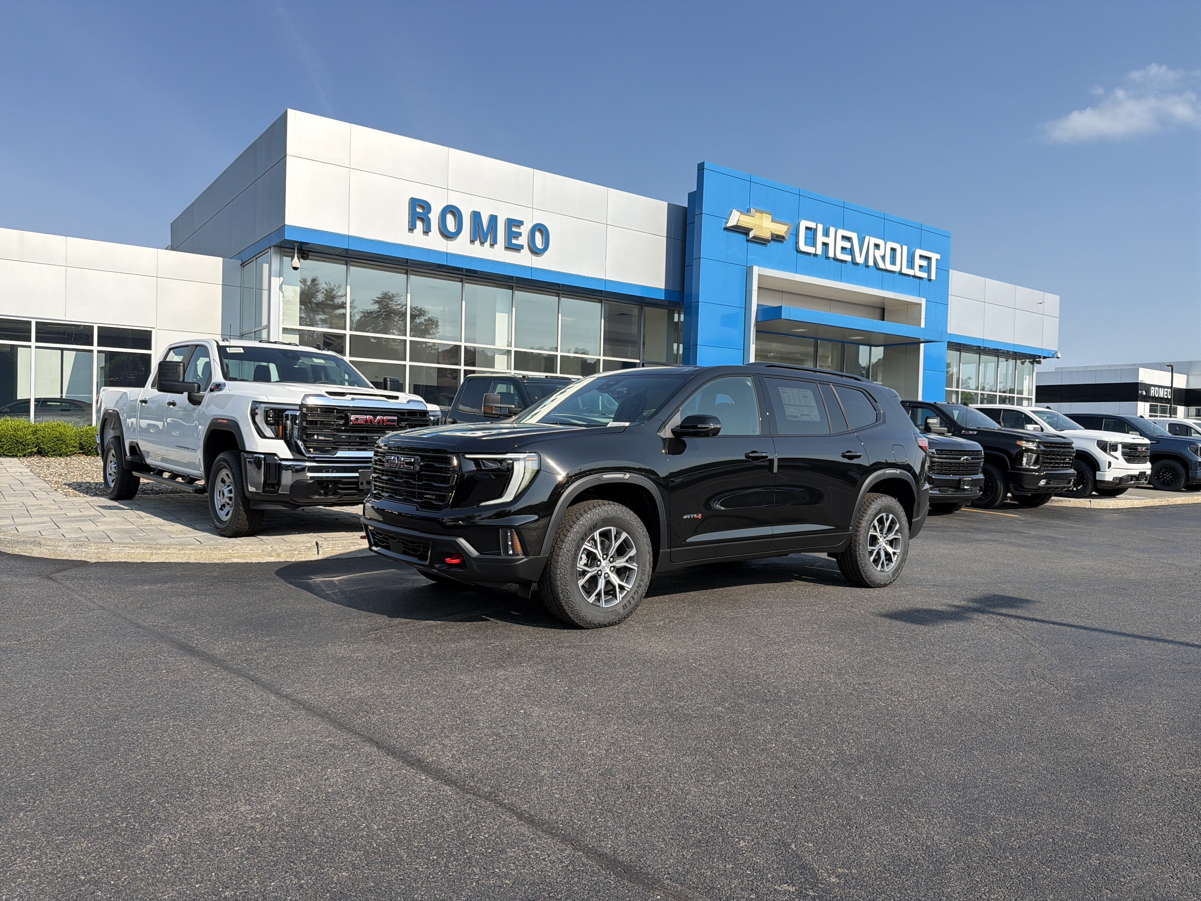 2026 GMC Acadia AT4 in Ebony Twilight Metallic — front three-quarter view