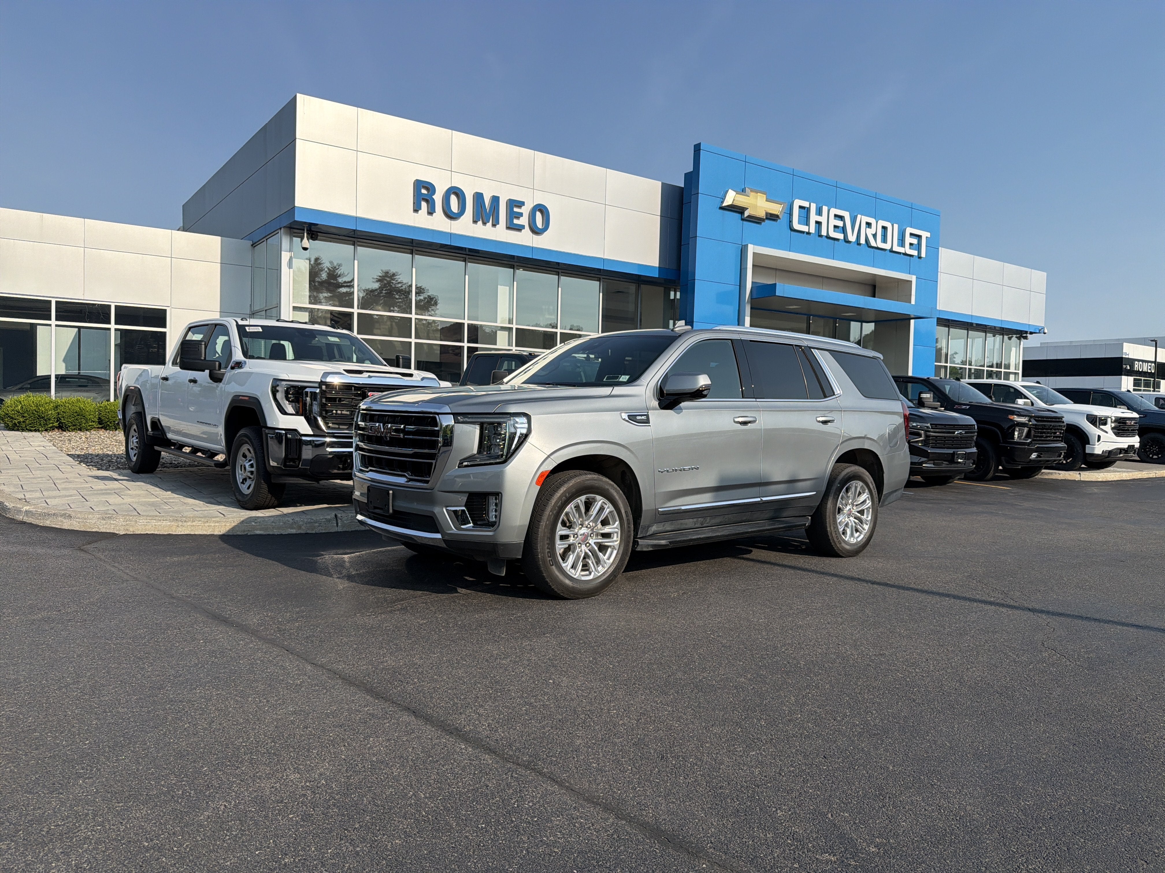 2024 GMC Yukon SLT in Sterling Metallic — front three-quarter view