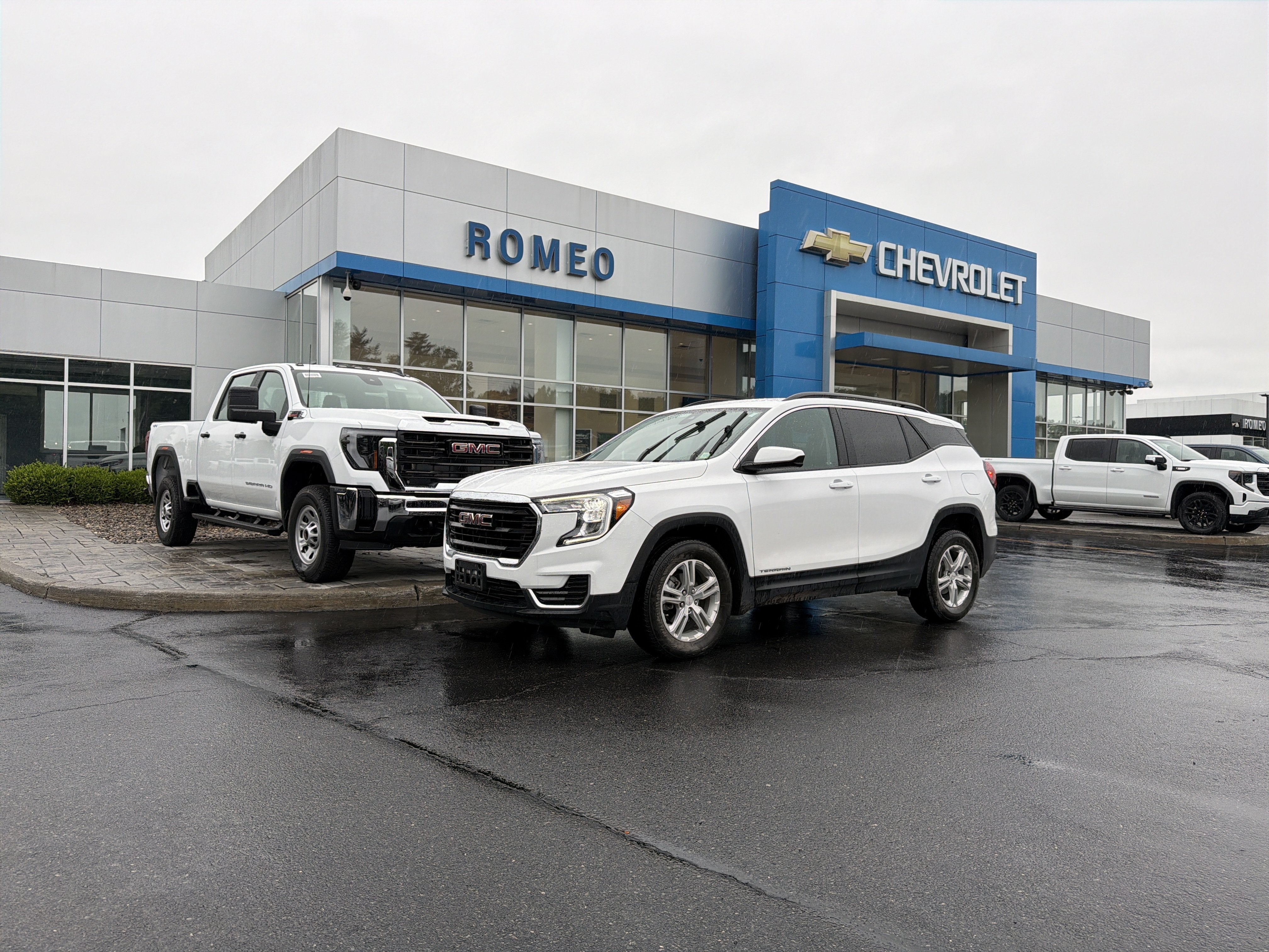 2024 GMC Terrain SLE in Summit White — front three-quarter view
