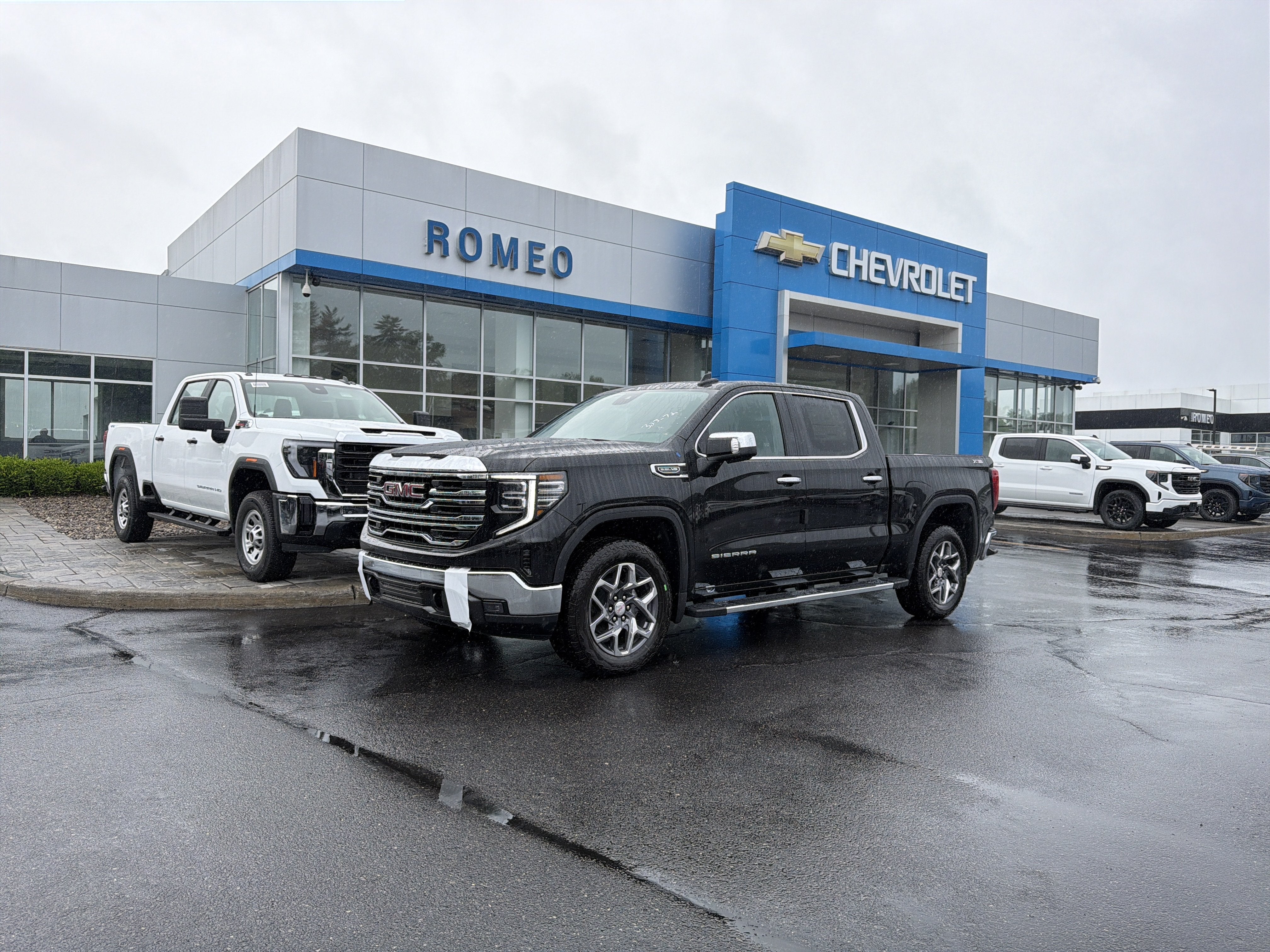 2026 GMC Sierra 1500 SLT in Onyx Black — front three-quarter view