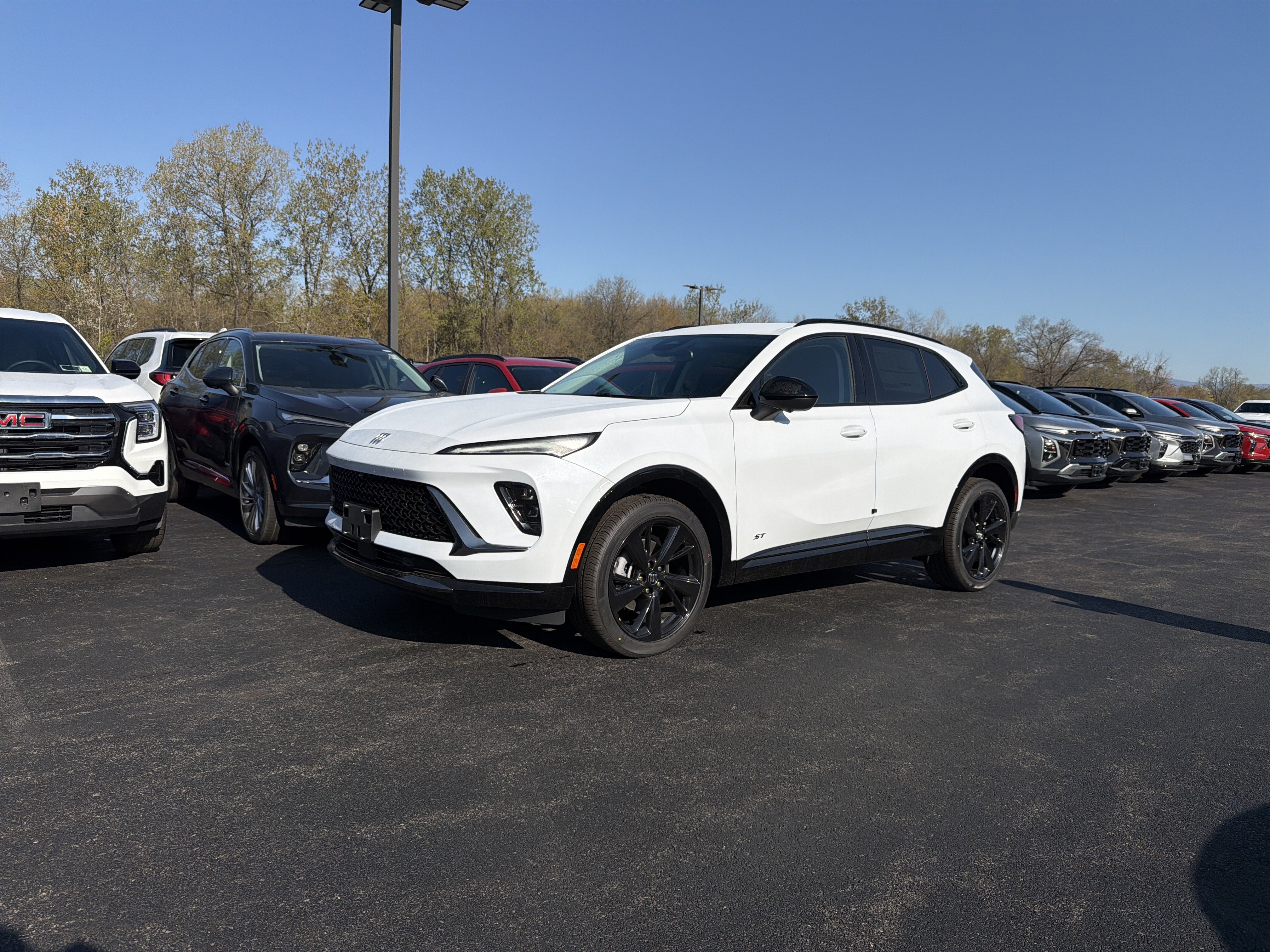 2026 Buick Envision Sport Touring in Iridescent White Tricoat — front three-quarter view